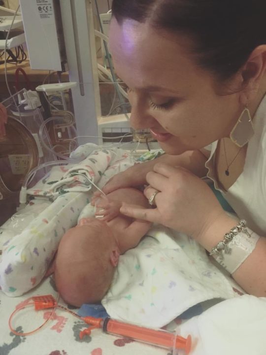 NICU graduate's photo of he and mother in NICU pod at bed space