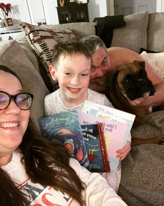 family reading Happy Birthday reads